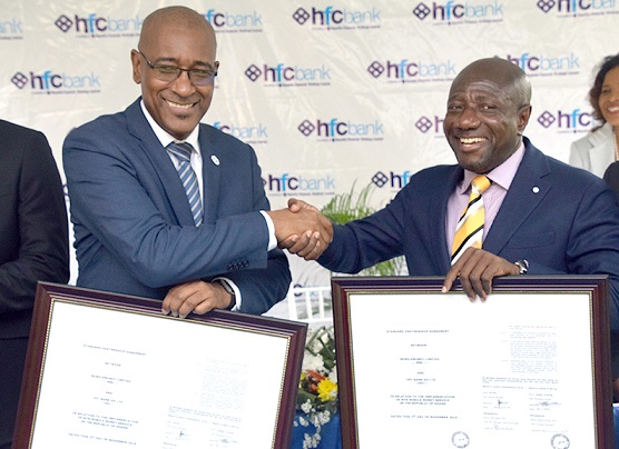 Mr Robert Le Hunte (left) in a handshake with Mr Ebenezer Asante, CEO, MTN Ghana